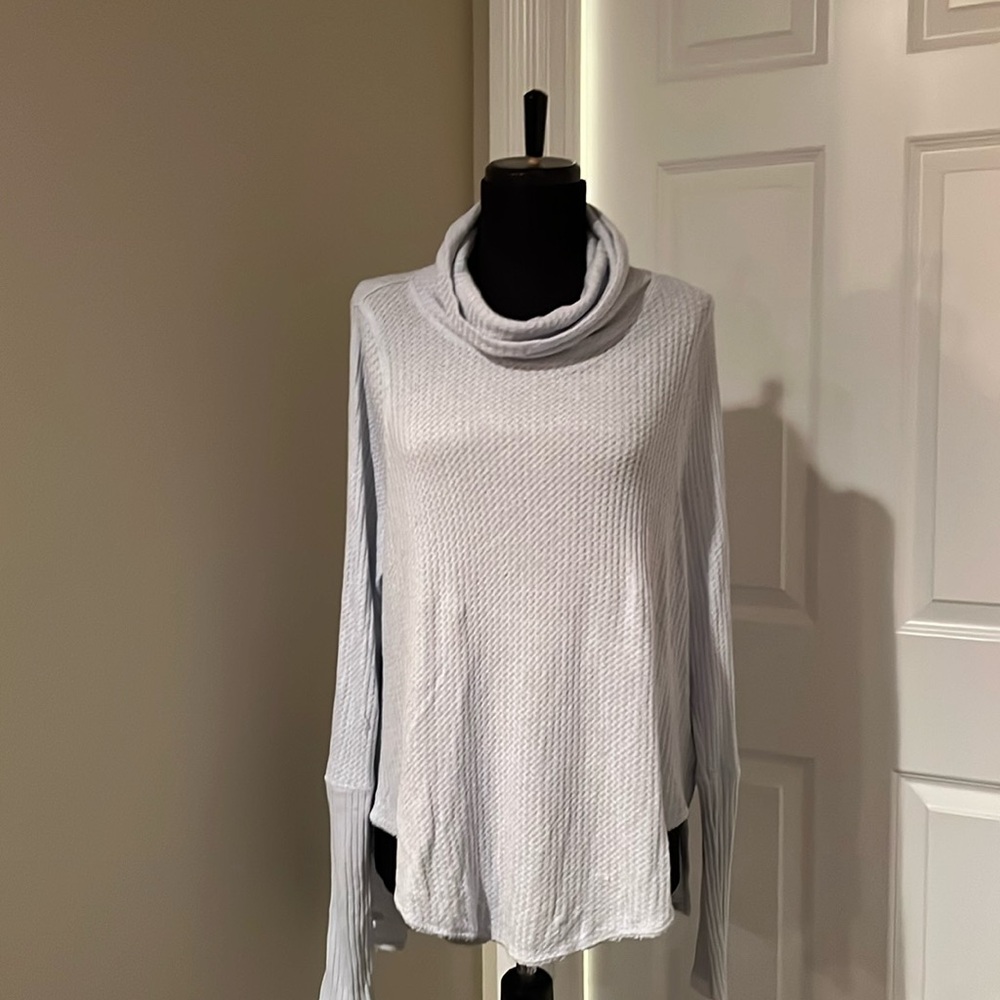We the Free size medium.  Long sleeve top. Color light blue